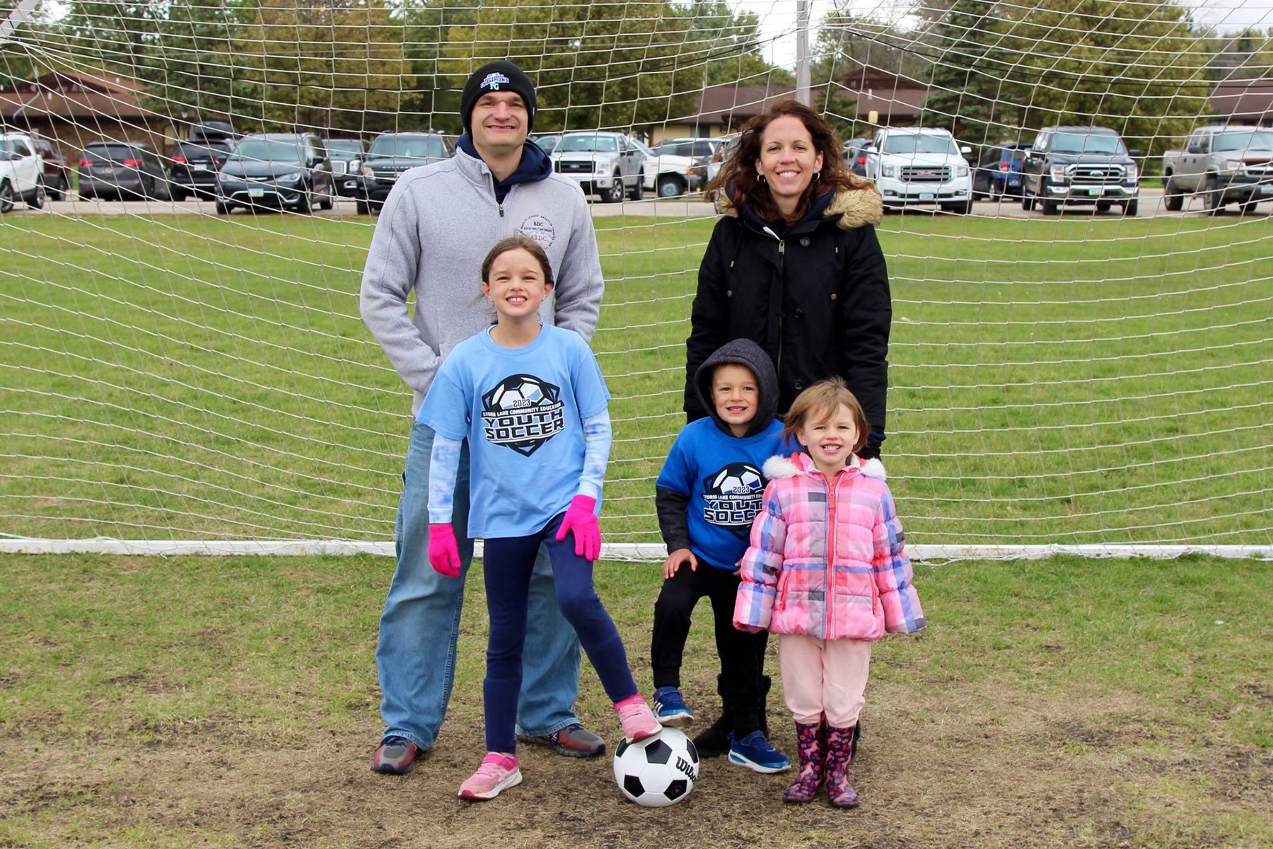 Dr. Glienke with wife and three children at a soccer field